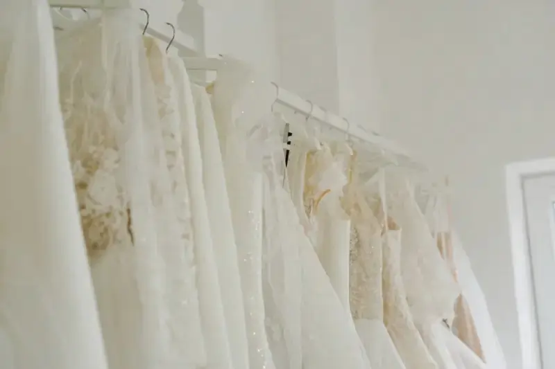 Elegant display of Rosa Clará wedding dresses in a bridal boutique showcasing Spanish designer gowns
